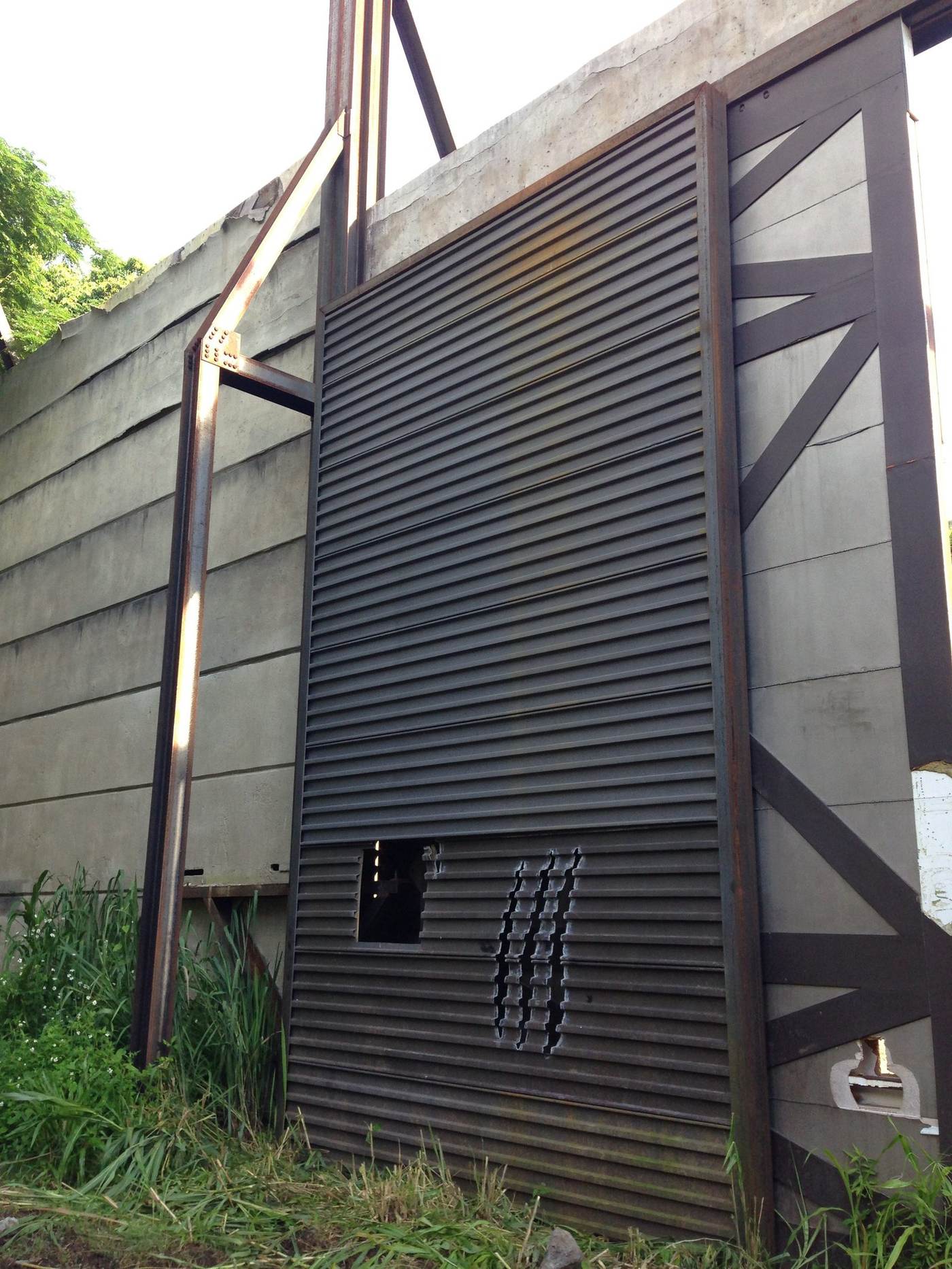 Jurassic World steel gate closeup — PADDCO custom fabrication